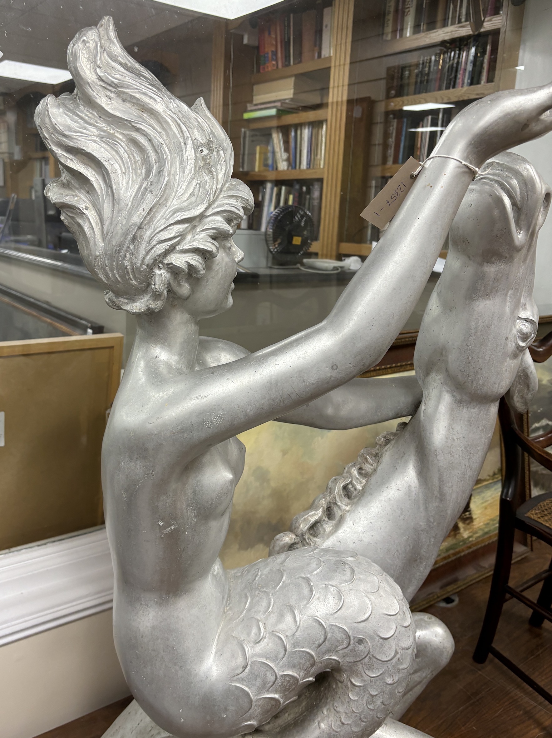 Arthur Fleischmann (1896-1990), an aluminium figure of 'Esther' astride a hippocamp, height 110cm, removed from The Shaw Savill cruise liner 'The Ocean Monarch', with original brochure and invoice